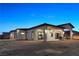 Modern home exterior with covered patio and landscaped yard at 311 Belfast St, Henderson, NV 89015