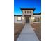 Elegant front entry with stone accents and modern lighting at 311 Belfast St, Henderson, NV 89015