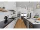 Modern kitchen with black countertops and white cabinets at 311 Belfast St, Henderson, NV 89015