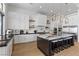 Modern kitchen with white cabinets and a large island at 311 Belfast St, Henderson, NV 89015