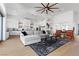 Spacious living room with sectional sofa and open concept kitchen at 311 Belfast St, Henderson, NV 89015