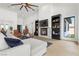 Bright living room featuring a stone fireplace and comfy seating at 311 Belfast St, Henderson, NV 89015