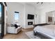 Main bedroom with fireplace, large windows, and sitting area at 311 Belfast St, Henderson, NV 89015