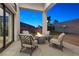 Covered patio with fire pit and comfortable seating at 311 Belfast St, Henderson, NV 89015