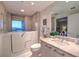 Modern bathroom with walk-in shower and large vanity at 322 Karen Ave # 1001, Las Vegas, NV 89109