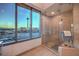 Bathroom with large shower, city views, and modern fixtures at 322 Karen Ave # 1001, Las Vegas, NV 89109