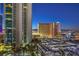 Night view of a highrise building with city lights and parking at 322 Karen Ave # 1001, Las Vegas, NV 89109