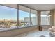 Living room with expansive windows and city views at 322 Karen Ave # 1001, Las Vegas, NV 89109