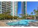 Inviting pool area with a waterfall and comfortable seating at 322 Karen Ave # 1001, Las Vegas, NV 89109