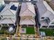 Aerial view of houses with backyard patios, fire pits, and grassy areas at 355 Purple Sandpiper St, Las Vegas, NV 89138