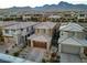 Aerial view of houses in a community with mountain views at 355 Purple Sandpiper St, Las Vegas, NV 89138