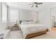 Bright bedroom with light walls and wooden bed frame at 355 Purple Sandpiper St, Las Vegas, NV 89138