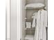 Well-organized linen closet with shelving and hanging space at 355 Purple Sandpiper St, Las Vegas, NV 89138