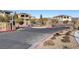 Gated community entrance with stone pillars and landscaping at 355 Purple Sandpiper St, Las Vegas, NV 89138