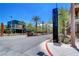 Community entrance with palm trees and signage at 355 Purple Sandpiper St, Las Vegas, NV 89138