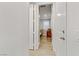 Light hallway with doors to bedrooms and light wood floors at 355 Purple Sandpiper St, Las Vegas, NV 89138