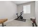 Room with an exercise bike, weights, and a small desk at 355 Purple Sandpiper St, Las Vegas, NV 89138