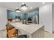 Modern kitchen with blue cabinets and marble countertops at 355 Purple Sandpiper St, Las Vegas, NV 89138