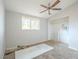 Simple bedroom with ceiling fan and window at 3644 San Pascual Ave, Las Vegas, NV 89115