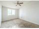 Simple bedroom with ceiling fan and window at 3644 San Pascual Ave, Las Vegas, NV 89115