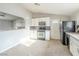 View of a kitchen with white cabinets and dark gray backsplash at 3644 San Pascual Ave, Las Vegas, NV 89115