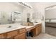 Main bathroom with double sinks and a walk-in shower at 3940 Colonial Field Ave, North Las Vegas, NV 89031