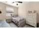 Cozy bedroom with a dresser and ceiling fan at 3940 Colonial Field Ave, North Las Vegas, NV 89031