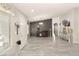 Bright and airy living room with gray floors, decorative accents and a view of the entry at 3940 Colonial Field Ave, North Las Vegas, NV 89031