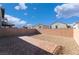 Landscaped backyard with brick patio and gravel at 406 Misterioso St, Henderson, NV 89011