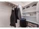 Well-organized closet with shelves for storage and hanging rods at 406 Misterioso St, Henderson, NV 89011