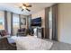 Living room with gray sofas, large TV, and fluffy rug at 406 Misterioso St, Henderson, NV 89011