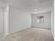 Spacious carpeted bedroom with large window and neutral walls at 4253 Gold Desert St, North Las Vegas, NV 89032