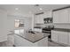 Modern kitchen with white cabinets, stainless steel appliances, and an island at 4253 Gold Desert St, North Las Vegas, NV 89032