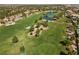 Community view showcasing a lush golf course and lake at 43 Innisbrook Ave, Las Vegas, NV 89113