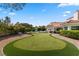 Expansive backyard featuring a putting green and pool at 43 Innisbrook Ave, Las Vegas, NV 89113