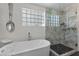 Spa-like bathroom with soaking tub and glass shower at 43 Innisbrook Ave, Las Vegas, NV 89113