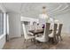 Elegant dining room with a live edge table and crystal chandelier at 43 Innisbrook Ave, Las Vegas, NV 89113