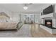 Main bedroom with ornate bed, fireplace, and hardwood floors at 43 Innisbrook Ave, Las Vegas, NV 89113