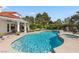 Inviting kidney shaped pool with spa and waterfall feature at 43 Innisbrook Ave, Las Vegas, NV 89113