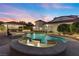 Resort style pool and spa with a covered patio at 43 Innisbrook Ave, Las Vegas, NV 89113