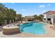 Relaxing kidney-shaped pool with spa and outdoor seating at 43 Innisbrook Ave, Las Vegas, NV 89113