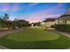 Private putting green provides entertainment in backyard at 43 Innisbrook Ave, Las Vegas, NV 89113