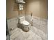 Clean bathroom with toilet and marble tile floor at 4381 W Flamingo Rd # 2208, Las Vegas, NV 89103