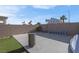 Large backyard with concrete patio and grassy area at 4613 Golden Palomino Ln, North Las Vegas, NV 89032