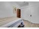 Bright bedroom with wood-look floors and closet at 4613 Golden Palomino Ln, North Las Vegas, NV 89032