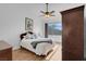 Bright bedroom with ceiling fan and large window at 4613 Golden Palomino Ln, North Las Vegas, NV 89032