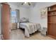 Cozy bedroom with wood-look floors and built-in shelving at 4613 Golden Palomino Ln, North Las Vegas, NV 89032