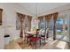 Dining area with table and chairs near sliding glass doors at 4613 Golden Palomino Ln, North Las Vegas, NV 89032