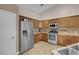 Modern kitchen with stainless steel appliances and corner sink at 4613 Golden Palomino Ln, North Las Vegas, NV 89032