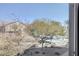 View of backyard with trees and community amenities at 4710 Frasers Owl Ave # 103, North Las Vegas, NV 89084